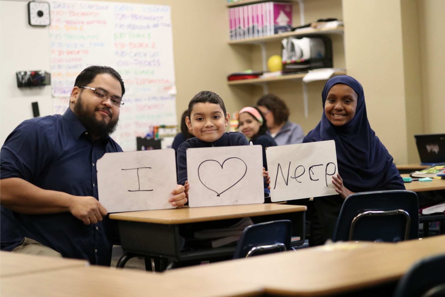 NECP Students with I Love NECP Sign